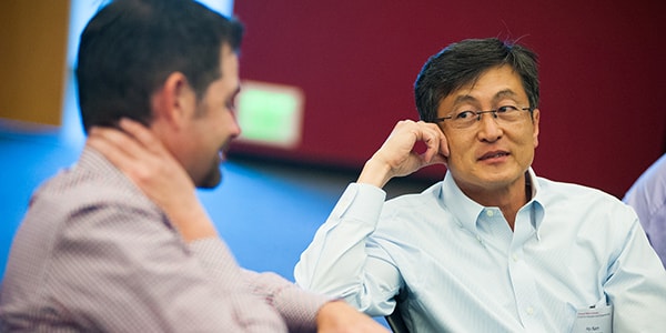 photo of investor speaking with a student.