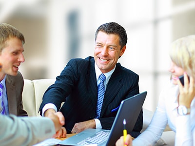 photo of investor shaking hands with student