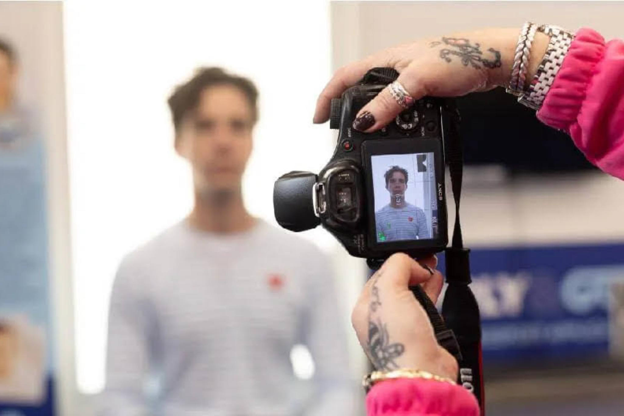 A student getting their passport photo taken