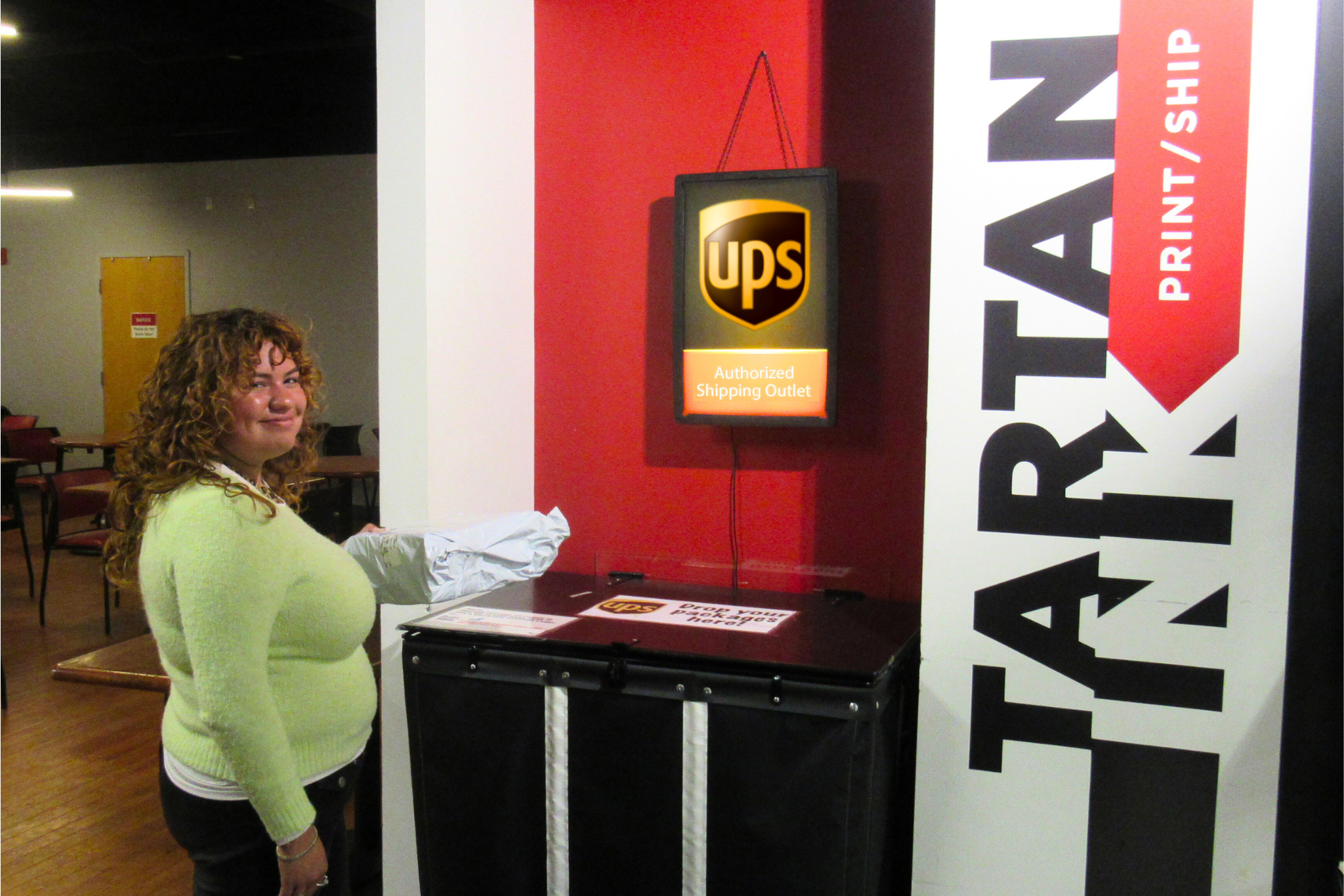 Student worker standing in front of Tartan Ink