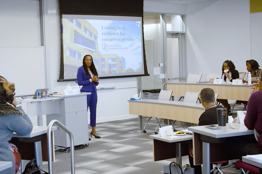 instructor standing in front of projection in classroom