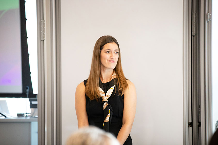 woman making her leadership presentation in a classroom