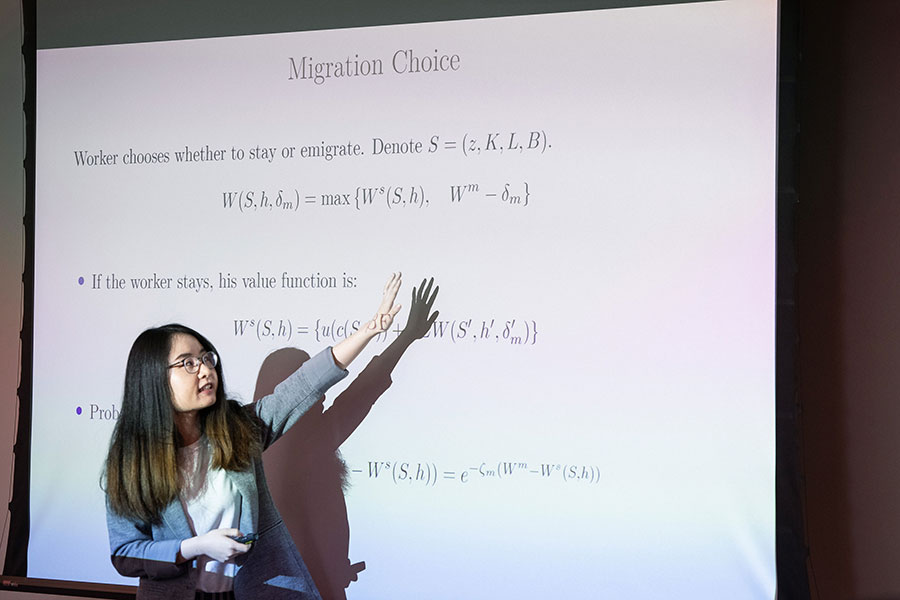 Female attendee presenting at screen