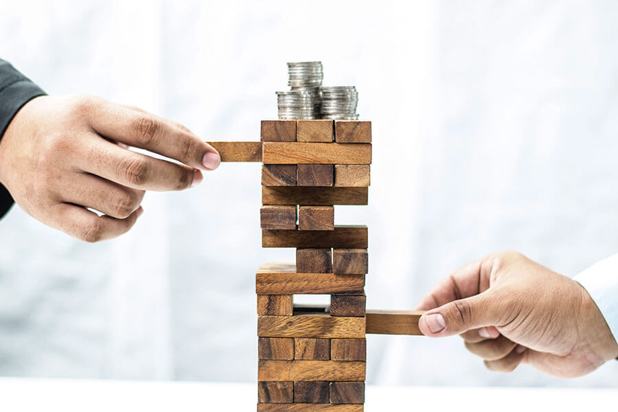 jenga with coins on top