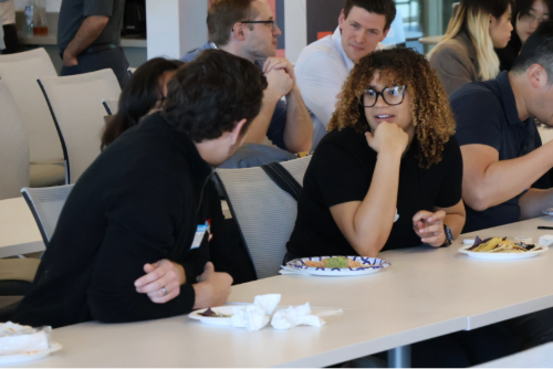 Two people sitting at a table talking