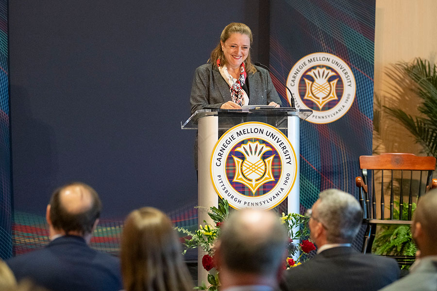 Dean Bajeux speaking to crowd at her installation