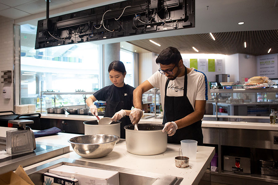 capital grains student workers preparing food