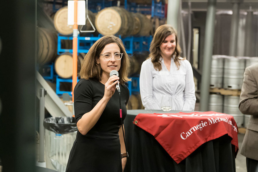 Meredith Grelli speaking to Tepper alumni at Wigle Whiskey