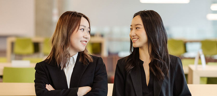 Two female MSBA students in the masters lounge