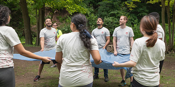 MBA Students with parachute cloth at BaseCamp