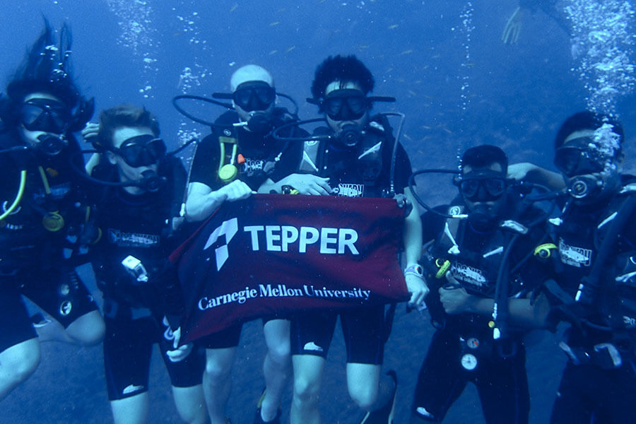 Students scuba dive in hong kong