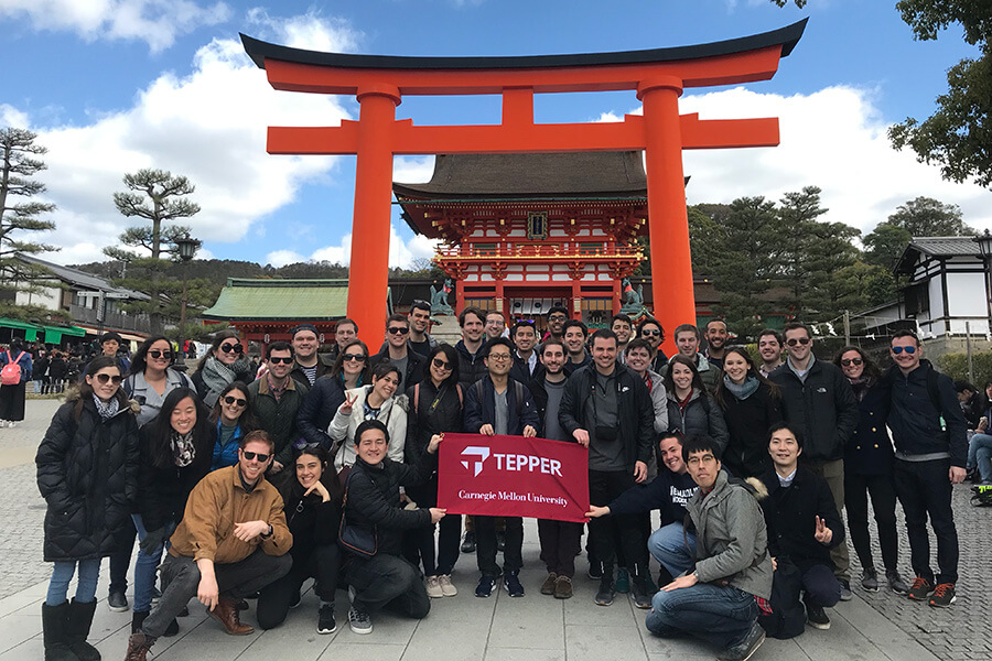 Student in Japan in front of a temple