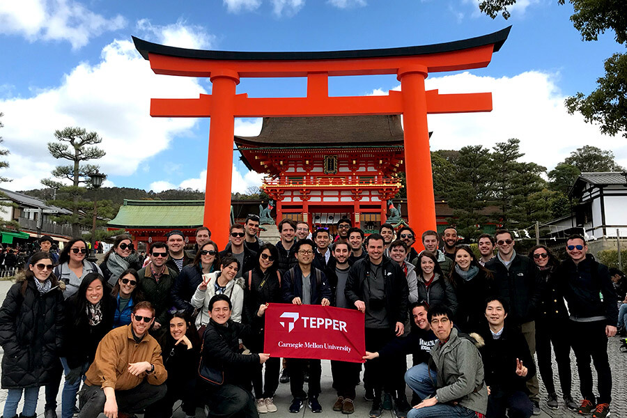 MBA students in Japan, in front of Asian gate.