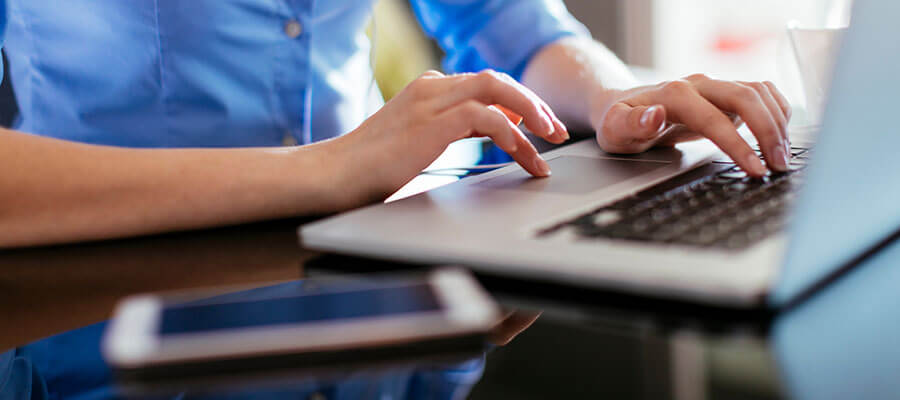 Female hands on a keyboard