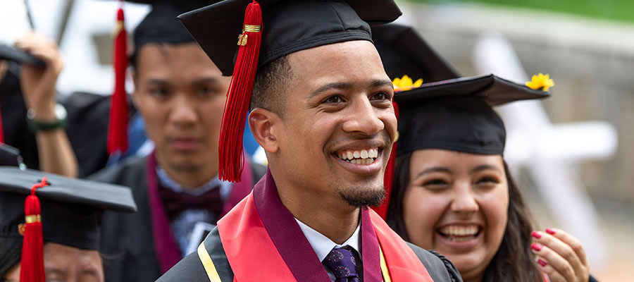 Students in graduation cap and gown