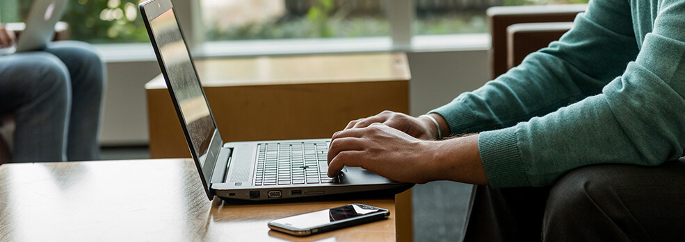 Online MBA student with laptop