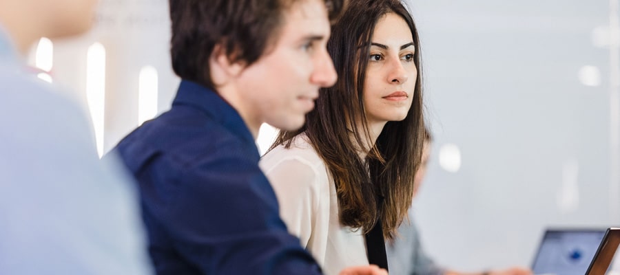 photo of two phd candidates sitting in phd suite discussing work