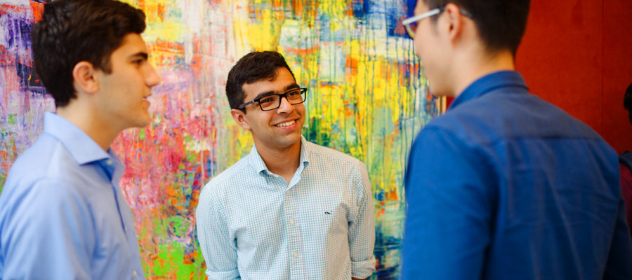 Three male tepper students socializing