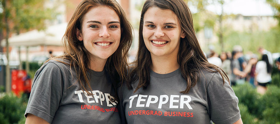 Two female students in Tepper t-shirts