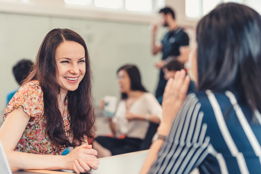 photo of Ph.D. student speaking with a recruiter