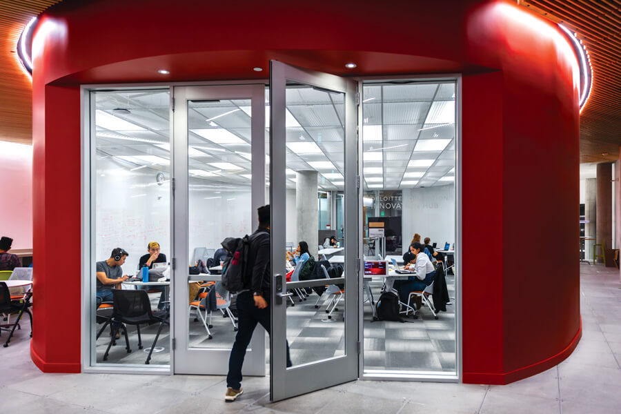 Photo of student walking into classroom