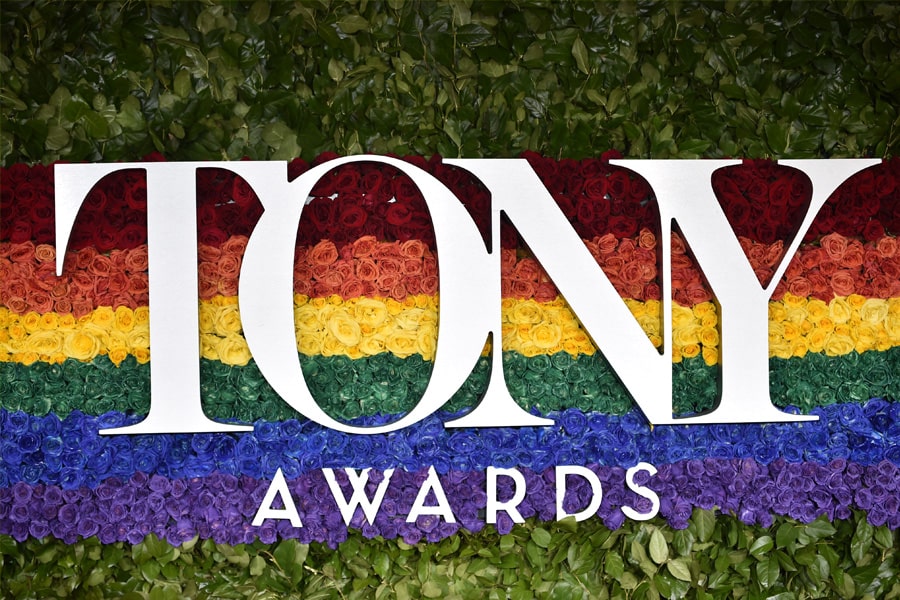 Photo of Tony Awards logo with rainbow rose display.