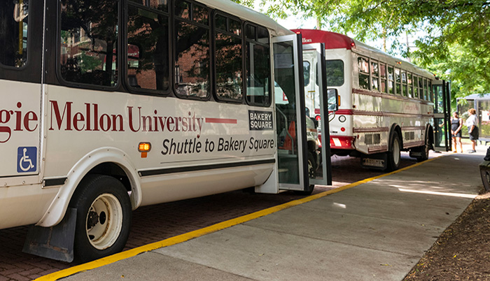 Busses parked at a curb