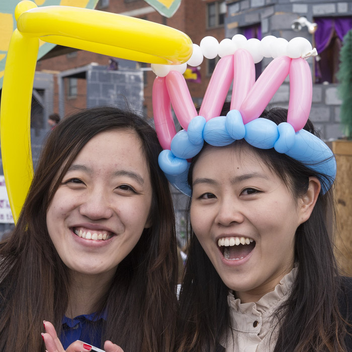 Students with balloon hats on their heads.