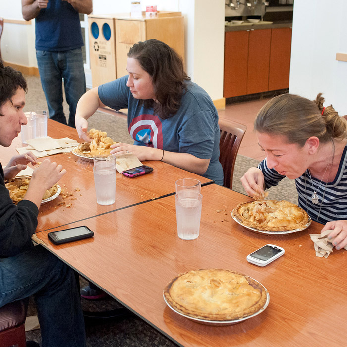 People participating in a pie eating contest.