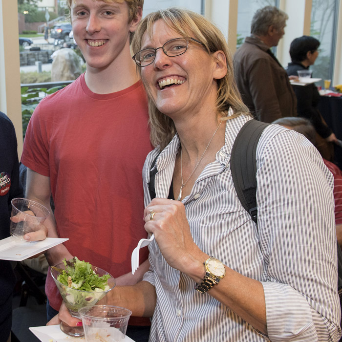 Happy woman holding a salad.