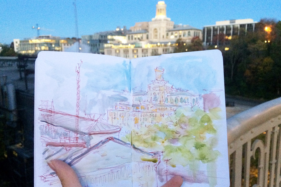 Artistic portrayal of Carnegie Mellon campus in sketchbook with actual scene in background
