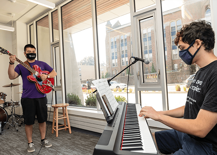 CMU's jazz band practices in the Commons' jam room