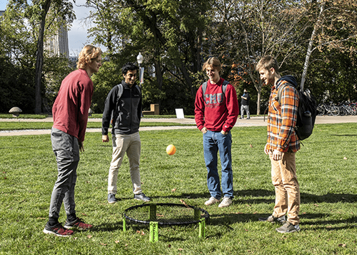 Group of students plays a game on the Cut during Tartan Community Day