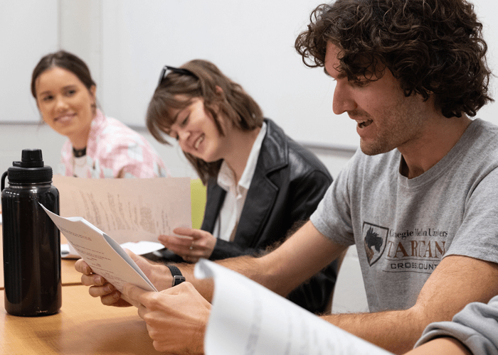 CMU students happily read aloud and critique each other's scripts in an advanced screenwriting class.