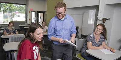 People sitting at desks smiling